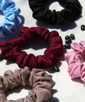 athletic-scrunchies in red, black, pink, and blue.