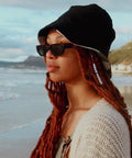 Black Bucket Hat combined with black sunglases.