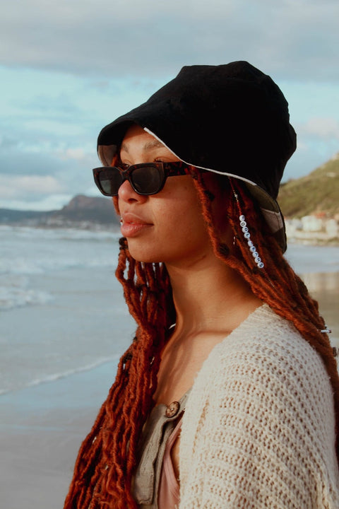 Black Bucket Hat combined with black sunglases.