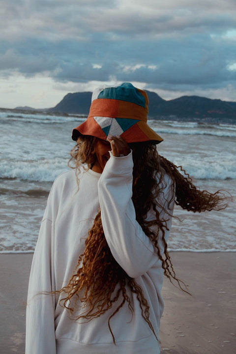 Patchwork Bucket Hat presented at the beach in Cape Town.