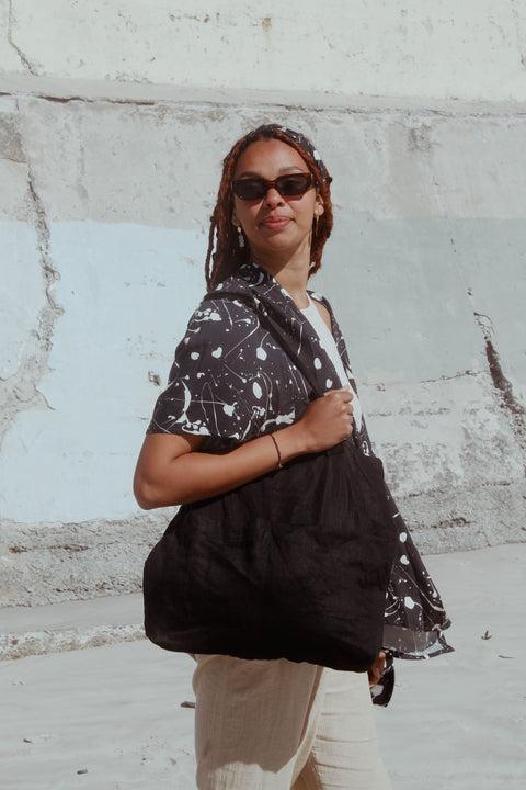 Black Tote Bag worn by a young woman