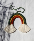 Mini macramé rainbow in green, gold, and red