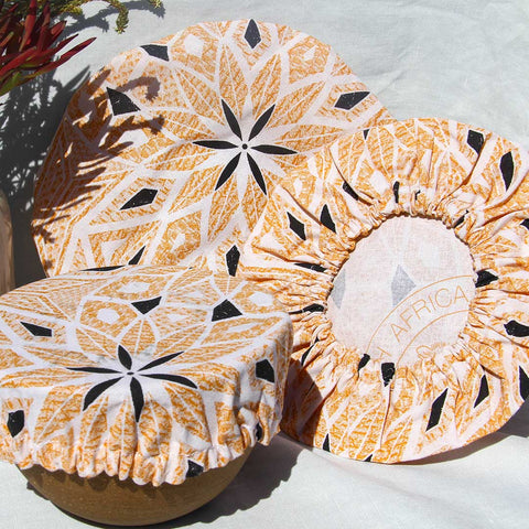 Bowl Covers in different sizes made with orange shweswhe fabric.