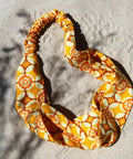 Yellow retro hairband with print.