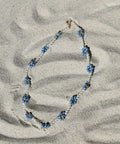 Blue Daisy Chain in the sand